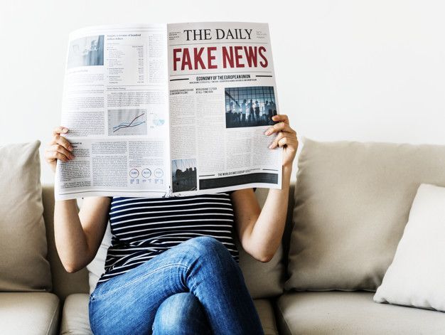 Woman reading newspaper
